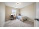 Bedroom featuring carpet flooring, a desk, a single bed and natural light from window at 702 Calavaras Ln, Knightdale, NC 27545