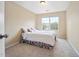 Bedroom with carpet flooring, a double bed and natural light from large window at 702 Calavaras Ln, Knightdale, NC 27545