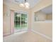 Bright dining area with sliding glass doors leading to the backyard, adjacent to the kitchen at 702 Calavaras Ln, Knightdale, NC 27545