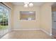 Bright dining area with sliding glass doors and view through to living area at 702 Calavaras Ln, Knightdale, NC 27545
