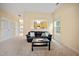 Spacious living room featuring plush carpet, a view into the adjoining kitchen area, and neutral color scheme at 702 Calavaras Ln, Knightdale, NC 27545