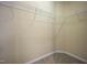 Walk-in closet with neutral carpet and shelving at 702 Calavaras Ln, Knightdale, NC 27545