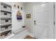 Entryway featuring a built-in bench with storage, coat hooks, and a decorative door at 704 Haven Peak Ln, Wake Forest, NC 27587