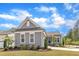 Beautiful home with gray siding, a well-maintained lawn, and lovely landscaping at 704 Haven Peak Ln, Wake Forest, NC 27587