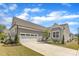 Charming single-Gathering home with a two-car garage and a well-manicured lawn in a residential neighborhood at 704 Haven Peak Ln, Wake Forest, NC 27587