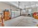 Well-lit garage space showing a large door, shelving, and potential for vehicle storage at 704 Haven Peak Ln, Wake Forest, NC 27587