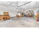 Spacious garage with ample room for storage, a functional workshop area, and parking at 704 Haven Peak Ln, Wake Forest, NC 27587