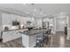 Modern kitchen with white cabinetry, granite countertops, stainless steel appliances, and spacious layout at 704 Haven Peak Ln, Wake Forest, NC 27587