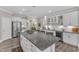 Bright kitchen with large island, granite counters, stainless appliances, and seamless access to additional amenities at 704 Haven Peak Ln, Wake Forest, NC 27587