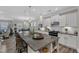 Spacious kitchen features a large island, granite countertops, stainless appliances, and modern pendant lighting at 704 Haven Peak Ln, Wake Forest, NC 27587