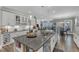 Spacious kitchen island with granite countertops, stainless steel sink, and ample storage at 704 Haven Peak Ln, Wake Forest, NC 27587