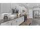 Modern kitchen showcasing stainless appliances, granite countertops, and sleek, white cabinetry at 704 Haven Peak Ln, Wake Forest, NC 27587