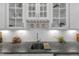 Close-up of a granite countertop with a stainless steel sink and white subway tile backsplash at 704 Haven Peak Ln, Wake Forest, NC 27587