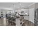 Modern kitchen with large island, granite counters, stainless steel appliances, and pendant lighting at 704 Haven Peak Ln, Wake Forest, NC 27587