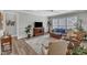 Inviting living room with hardwood floors, a large window, and comfortable furniture at 704 Haven Peak Ln, Wake Forest, NC 27587