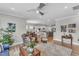 Spacious living room with hardwood floors that open to the kitchen and dining area at 704 Haven Peak Ln, Wake Forest, NC 27587