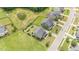A high angle view of a residential neighborhood featuring well-maintained lawns and modern homes with attached garages at 710 Legacy Falls S Dr, Chapel Hill, NC 27517