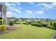The expansive backyard features lush green grass and decorative landscaping, creating a private and serene outdoor space at 710 Legacy Falls S Dr, Chapel Hill, NC 27517