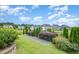 The backyard features meticulously maintained landscaping, a bocce ball court, and is perfect for outdoor activities and relaxation at 710 Legacy Falls S Dr, Chapel Hill, NC 27517