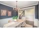 Elegant dining room with a chandelier, neutral decor, and a view of the staircase at 710 Legacy Falls S Dr, Chapel Hill, NC 27517