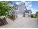 The exterior features a three car garage, a well maintained lawn, and a professionally landscaped yard at 710 Legacy Falls S Dr, Chapel Hill, NC 27517