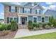 Inviting front entrance with stone accents and manicured bushes at 710 Legacy Falls S Dr, Chapel Hill, NC 27517