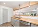 This kitchenette has butcher block countertop and stainless appliances, creating an industrial, modern aesthetic at 710 Legacy Falls S Dr, Chapel Hill, NC 27517