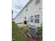 Wide angle of backyard with a small patio and air conditioning unit at 711 Keystone Park Dr # 78, Morrisville, NC 27560