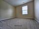 Neutral bedroom with carpeted floors and a bright window at 711 Keystone Park Dr # 78, Morrisville, NC 27560