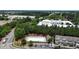 Aerial view of the community pool and amenities surrounded by mature trees and adjacent buildings at 711 Keystone Park Dr # 78, Morrisville, NC 27560