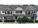 A beautiful townhouse featuring stone accents, neutral siding, and a well-maintained front yard at 711 Keystone Park Dr # 78, Morrisville, NC 27560