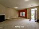 Bright Gathering room with neutral carpet, a cozy fireplace, and ample natural light streaming through the windows at 711 Keystone Park Dr # 78, Morrisville, NC 27560