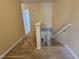 Upstairs hallway showcasing neutral walls and carpet at 711 Keystone Park Dr # 78, Morrisville, NC 27560