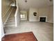 Spacious living room featuring an elegant fireplace and open staircase at 711 Keystone Park Dr # 78, Morrisville, NC 27560