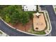 Aerial view of a fenced playground area with swings, slide, and ample play space at 711 Keystone Park Dr # 78, Morrisville, NC 27560