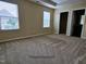 A spacious Primary bedroom with neutral carpet, two bright windows, and walk-in closet at 711 Keystone Park Dr # 78, Morrisville, NC 27560