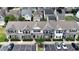 Aerial view of well-maintained townhomes with neutral exteriors, landscaping, and parking at 711 Keystone Park Dr # 78, Morrisville, NC 27560