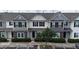 Charming townhomes featuring varied neutral-tone exteriors, well-manicured landscaping, and convenient parking at 711 Keystone Park Dr # 78, Morrisville, NC 27560