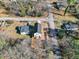 A high-angle perspective of a home with a fenced backyard and street access at 717 Utley St, Holly Springs, NC 27540