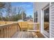 View of a wooden deck overlooking a fenced backyard at 717 Utley St, Holly Springs, NC 27540