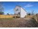 Spacious backyard with a wood fence and a deck, perfect for outdoor activities and enjoying the natural surroundings at 717 Utley St, Holly Springs, NC 27540
