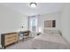 Comfortable bedroom has natural light, a desk, and a night stand at 717 Utley St, Holly Springs, NC 27540