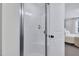 This bright bathroom features a white stand up shower with a view of the bedroom at 717 Utley St, Holly Springs, NC 27540