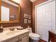 Neat powder room with attractive vanity and updated fixtures and storage at 7312 Sweet Bay Ln, Raleigh, NC 27615