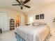 Calming bedroom with ceiling fan, ensuite access, and closet for storage at 7312 Sweet Bay Ln, Raleigh, NC 27615