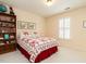 Charming bedroom with a comfortable-looking bed and a bookshelf at 7312 Sweet Bay Ln, Raleigh, NC 27615