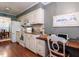 View of kitchen with an adjacent eating area and a built-in work station with a laptop at 7312 Sweet Bay Ln, Raleigh, NC 27615