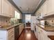 Spacious kitchen with ample counter space, stainless appliances, and a clear view into the dining room at 7312 Sweet Bay Ln, Raleigh, NC 27615