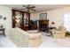 Inviting living room with a fireplace and a custom built-in display case for an elegant feel at 7312 Sweet Bay Ln, Raleigh, NC 27615