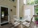 Outdoor patio area with a table and four chairs at 7312 Sweet Bay Ln, Raleigh, NC 27615